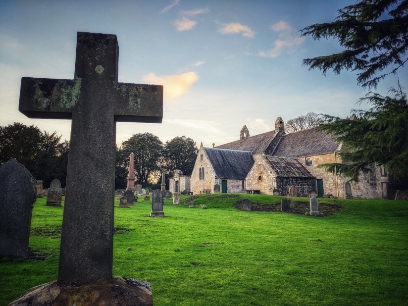 A cross in front of Abercorn Church.

